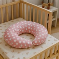مخدة رضاعة – لون وردي بنجوم بيضاء