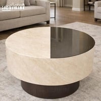 طاولة قهوة مودرن دائرية بسطح زجاجي وقاعدة حجرية أن...