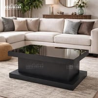 طاولة قهوة مودرن مستطيلة باللون الأسود مع سطح زجاج...