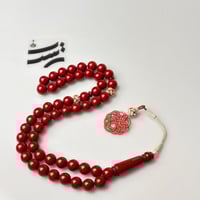 سبحة بكلايت لون أحمر دموي - طربزون وفواصل فضة عيار...