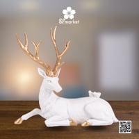 تحفة غزال ابيض جالس