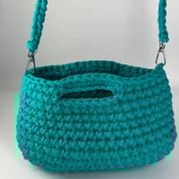 حقيبة يد لون واحد