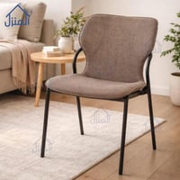 كرسي مودرن بقماش بني وقاعدة معدنية سوداء