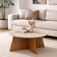 طاولة قهوة دائرية بسطح رخامي وقاعدة خشبية أنيقة