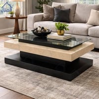 طاولة قهوة مودرن مستطيلة بسطح زجاجي وقاعدة حجرية