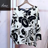 بلوزة واسعة خامة ناعمة مشجرة بياقة دائرية الأكمام...