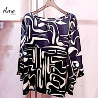 بلوزة واسعة خامة ناعمة مشجرة بياقة دائرية الأكمام...