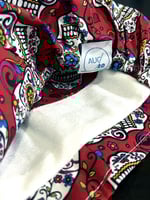 هيد كوفر أحمر برسمة جمجمة