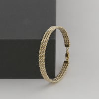 اسوارة ذهب واقف كرات الليزر مع فواصل بيضاء - عيار...