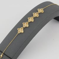 اسوارة ذهب خمس ازهار عيار 18