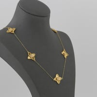 طقم ذهب بتصميم نجوم مموجة لماعة - عيار21