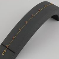 اسوارة ذهب مع فصوص حمراء - عيار 21