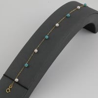 اسوارة ذهب بتصميم كرات اللؤلؤ مع كرات بلون تيفاني...