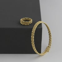 اسوارة و خاتم بتصميم عصري اشكال الليزر - عيار 18