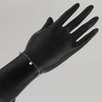 اسوارة ذهب بتصميم كرات اللؤلؤ مع كرات بلون تيفاني...