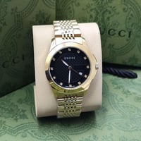 ساعه قوتشي ذهبي رجالي