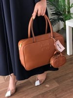 شنطه ميوميو مع التعليقه