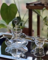 طقم لون اسود مكون من 6 كاسه و 6 فنجان كريستال مع ص...