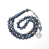 سبحة بكلايت ازرق بتمويجات بنية