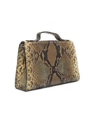 شنطة يد نسائية من NOUF AL GENAEI – فخامة الجلد الأ...