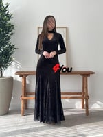 فستان سهرة أسود مخملي بأكمام طويلة وتفاصيل دانتيل...
