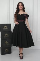 فستان نجلاء الراقي أسود مطرز .. فستان السن المحير