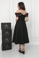 فستان نجلاء الراقي أسود مطرز .. فستان السن المحير