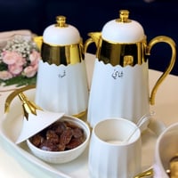 طقم أبيض مذهب 6 قطع ترمس شاي وترمس قهوة وصينية وتم...