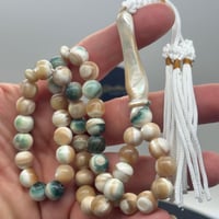 سبحة صدف بحري طبيعي حر