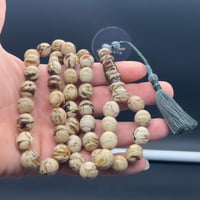 سبحة كهرمان سومطري ملطخ قص بيضاوي