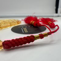 سبحة كهرمان بلطيقي شفاف قص صنوبري