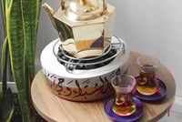 قاعدة تدفئة بتصميم ذهبي ( مخصصة بالاسم أو عبارة )