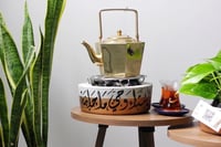 قاعدة تدفئة بتصميم ذهبي ( مخصصة بالاسم أو عبارة )