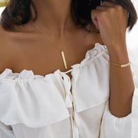 طقم أنيق مكون من قطعتين باللون الذهبي (SET888) .