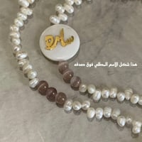 تعليقه بطاقه حجر اسود وخرز مطفي