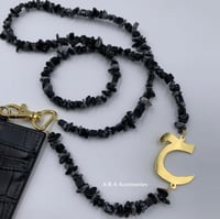 تعليقه بطاقه حجر رمادي واسود