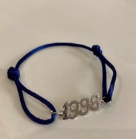 اسوارة خيط مع سنة الميلاد