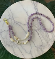 تعليقه بطاقه حجر بنفسجي