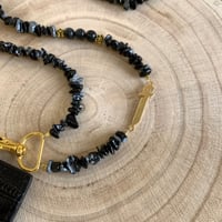 تعليقه بطاقه حجر اسود + بطاقه جلد اسود