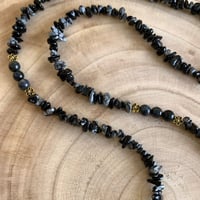 تعليقه بطاقه حجر اسود + بطاقه جلد اسود