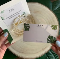 تعليقه جوال حجر اسود ممزوج بالابيض