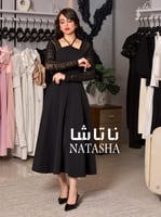 فستان ابيض مع اكمام طويلة شفافة وفتحة صدر انيقة