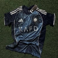 تيشيرت النصر الاحتياطي الثالث لموسم 2026 بشعار الن...