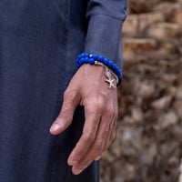 أسورة + سبحة حجر بركاني كحلي شكل سيفين ونخلة