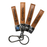 ميدالية جلد بشعار سيارتك | ABD