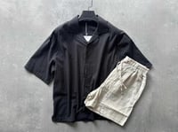 black shirt with biege short