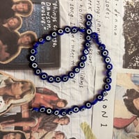 خرز عين زرقاء زجاجية