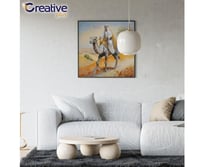 هجان بالزي التقليدي على ظهر جمله مرسوم على لوحة جد...