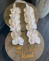 طوق تخرج اوركيد ابيض