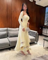 فستان أصفر ميدي بقصة أنثوية فاخرة